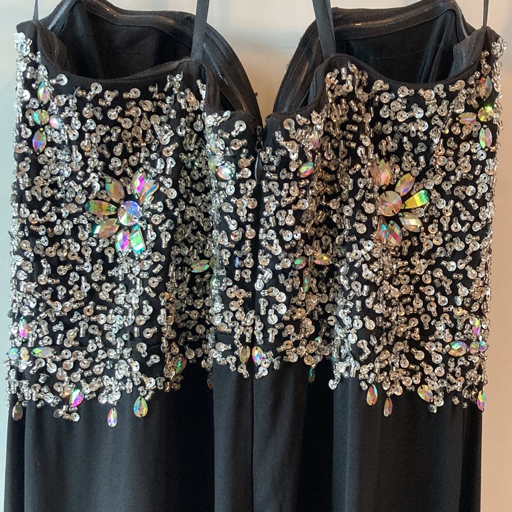 Long bejeweled black prom dress with thin straps and slit up to the thigh. - Picture 6 of 12